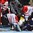 GRAND FORKS, NORTH DAKOTA - APRIL 24: USA's Nicholas Pastujov #9, Canada's Evan Fitzpatrick #1 and Canada's Brett Howden #10 get tangled up at the net during bronze medal game action at the 2016 IIHF Ice Hockey U18 World Championship. (Photo by Matt Zambonin/HHOF-IIHF Images)


